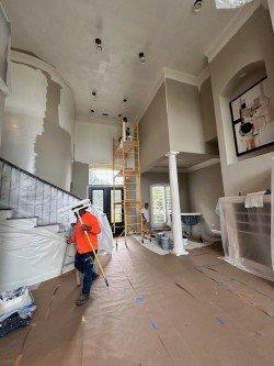 Queens Harbor home.  Floors covered, Starting painting