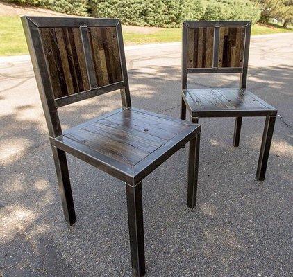 Steel and reclaimed truck flooring chairs.