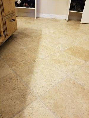 After cleaning if a natural travertine floor with hot water extraction and reseal.