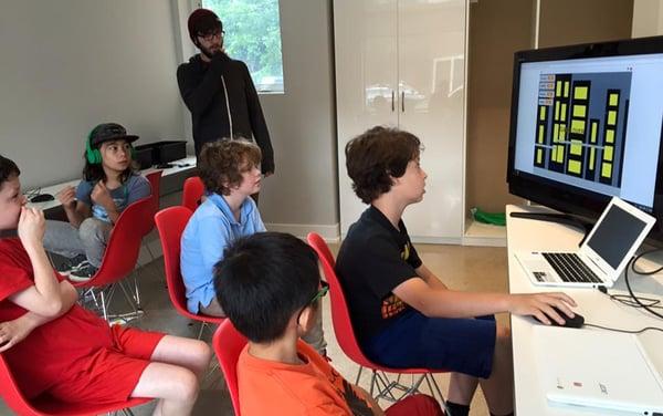 Demo of a side scrolling video game. Watch out for airplanes, busses and street cleaners! Summer camp at Power Up Tech Academy.