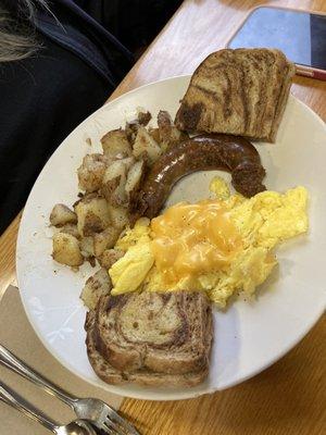 Scrambled Eggs, Fresh Sausage, Home Fries, and Rye Toast.