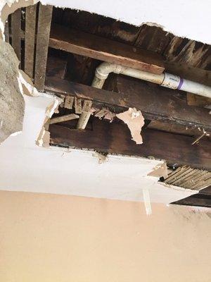 Floor joist overly notched out for plumbing!  Caused significant sag in flooring.