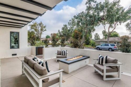 outdoor patio, concrete work, walls and fire pit.