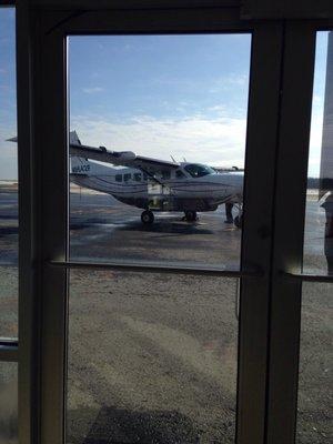 Flew in on this fun puddle jumper. Six passenger seats + two more for the pilots. Great window views.