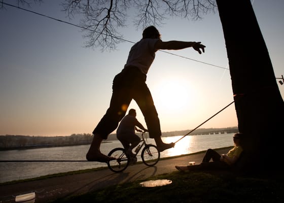 River Walk, a man tight ropes across trees along the Susquehanna River in Harrisburg, PA.