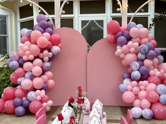 2 backdrop rentals, one is 8 ft the other is 6 ft. 2 balloon garlands 9 feet each. 3 colors plus an accent marble latex added.