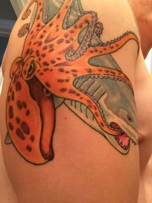 Tattoo of a great white in a tussle with a giant pacific octopus. Tommy was my artist.