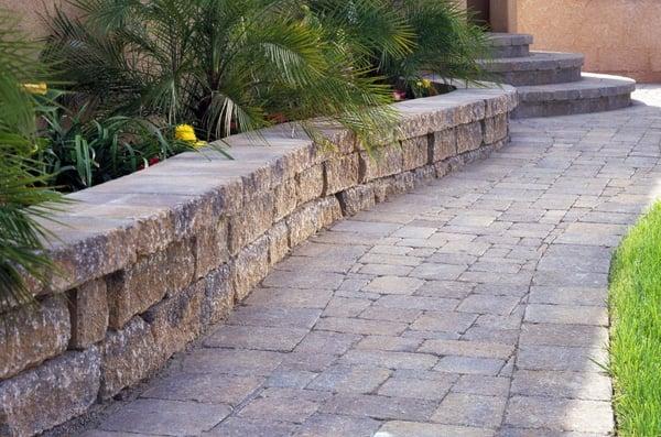 Whether you need a large stone wall to a small retaining wall to brighten up your front yard, we can do it!