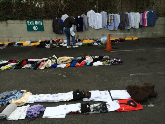 Donated clothing items are evenly distributed among homeless people attended on Sundays.