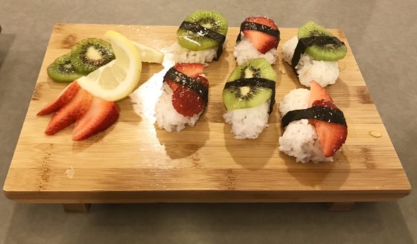 Fruit Nigiri - Cinnamon Sushi Rice, Peppered Honey glaze and nutmeg on assorted fruit.