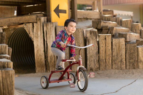 Photo taken in the playground on a tricycle in discovery school