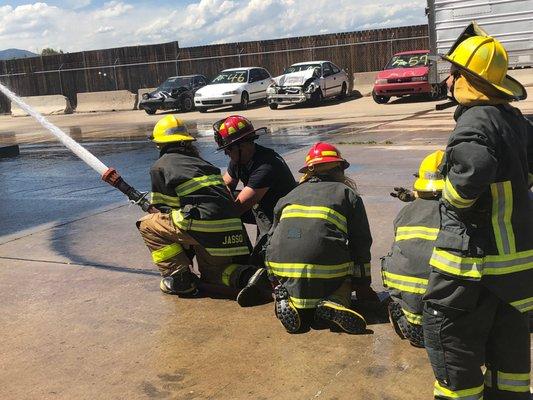 Girls learning hose control