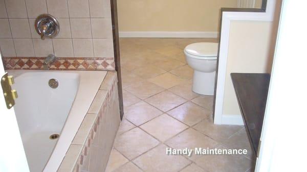 Bathroom flooring and plumbing fixtures installation