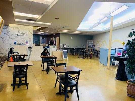 A huge lobby with plenty of tables and chairs to sit at, and some desktop computers for clients :) !