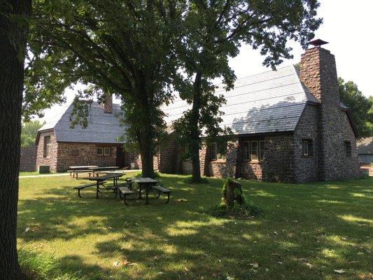 Classic historic stone building in picnic area.