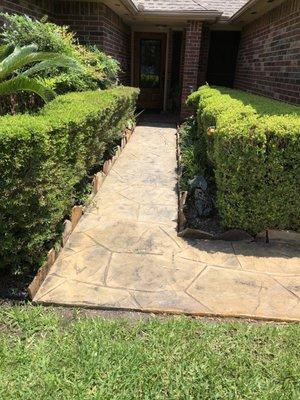 Half clear coating in entrance walkway making it a different shade from the other half.