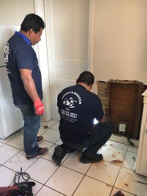 Two very professional plumbers at work.