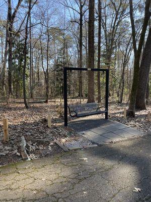 Swings line the main path instead of a boring rectangle cement bench!  (12/26/2022)