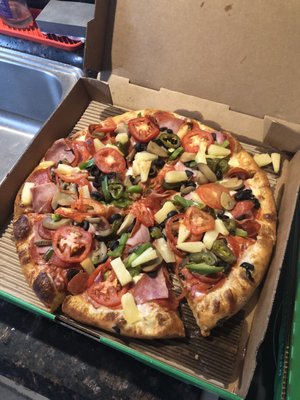 Deluxe pizza with added toppings - all raw veggies are not awesome on a pizza