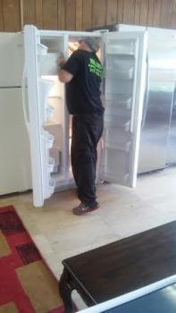 Charlie is checking temperatures to make sure that refrigerator and freezer are at correct temperature.