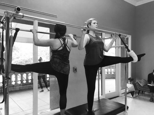 Friends stretching on the trapeze table!