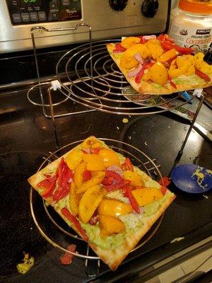 Made a avocado white base with yellow tomatoes, onion and red pepper flat bread from ingredients in box