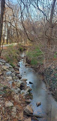 Soldier Creek along the trail. There's some coating on the water.  Could be an oil sheen from a functional pump jack not too far from here.