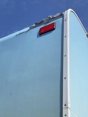 Damaged RV repaired by Cruise America rental with Duct tape