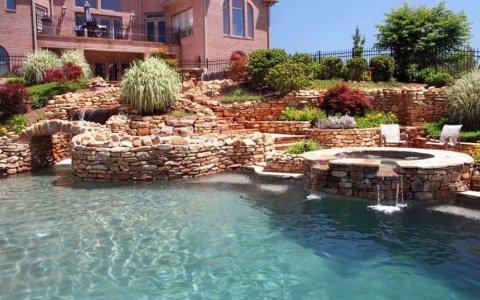 Multiple waterfalls cascade to the pool.