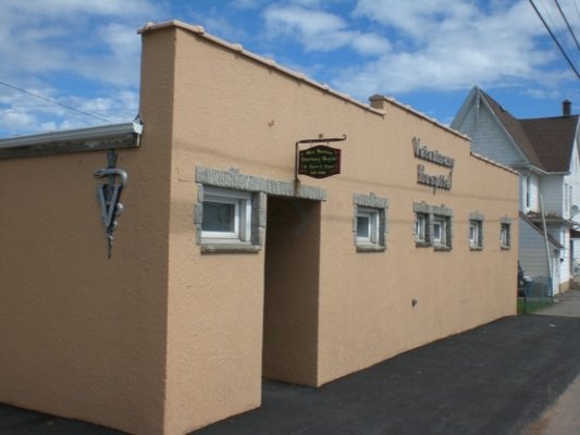 Newly Painted Building and Repaved Sidewalk