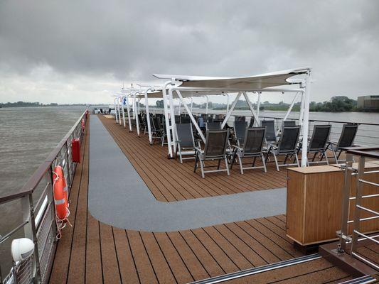 sun deck.  canopy folds flat when going under low bridges