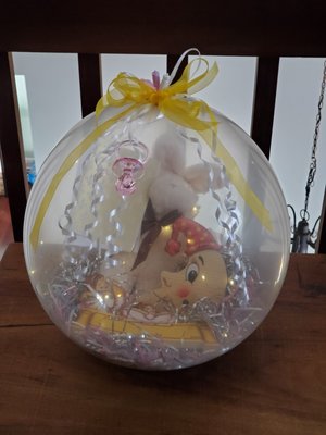 Balloon filled with a wood music box, children's name plate, picture clip and more!