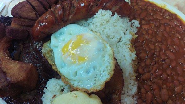 Bandeja Paisa: Grilled steak, fried pork belly, Colombian chorizo sausage, rice, red beans, fried egg, avocado, sweet plantain, arepita