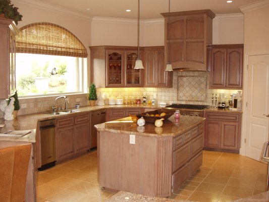 Carmel Kitchen Cabinets--repainted then added a faux antique glaze.