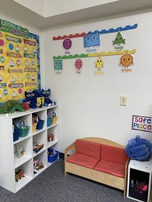 Our Book Corner has a variety of picture books, puppets, soft "book buddies" and comfortable seating.