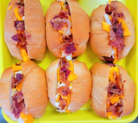 NEW! Mini Breakfast Dogs: Bacon, Eggs, & Cheese on a mini sausage, on a soft warm bun.