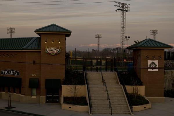 Quiet night at the entrance to the ballpark but look at the snow capped mountains in the background!