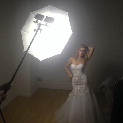 Lighting demo: two led video lights + a shoot through umbrella illuminating a beautiful model.