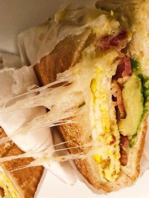 Breakfast sandwich. Bacon, egg, cheese & avocado