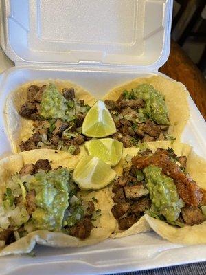 4 asada tacos with perfect amount of cilantro and onion came with guac too