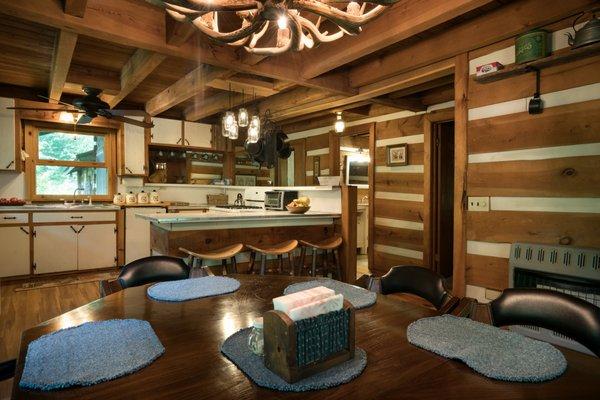 Dining room and kitchen with barstools