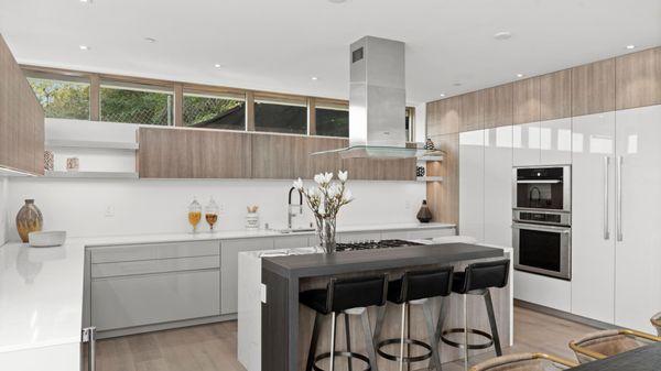 High-end European Modern LEICHT Kitchen. Sirius high-gloss door fronts mixed with Orlando Wood laminate tall cabinets