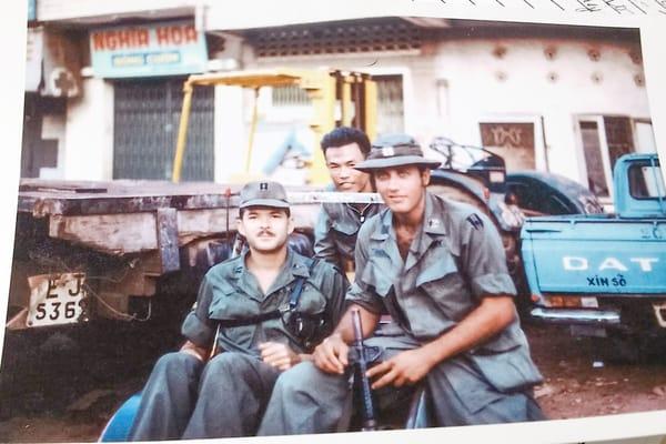 Another day in Viet Nam..Cpt David Firestone(boonie hat) and friend