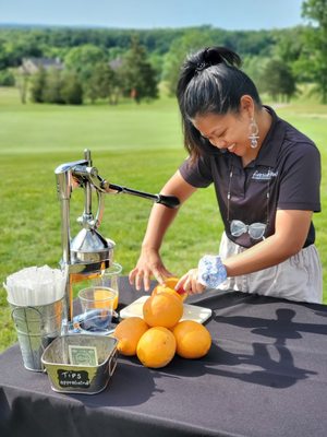 Hannah serving up some fresh squeezed orange juice for orange crushes