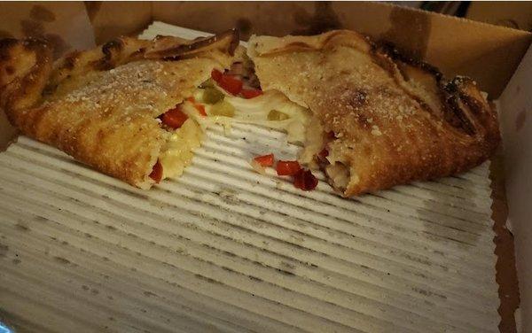 Calzone with cheese, peppers and WAY too many onions!