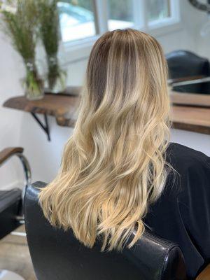 Baby blond tones with foil and balayage technique. Styled with Davines