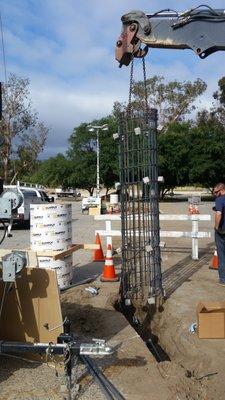 Setting Steel Cage for Parking Lot Light pole Footing.