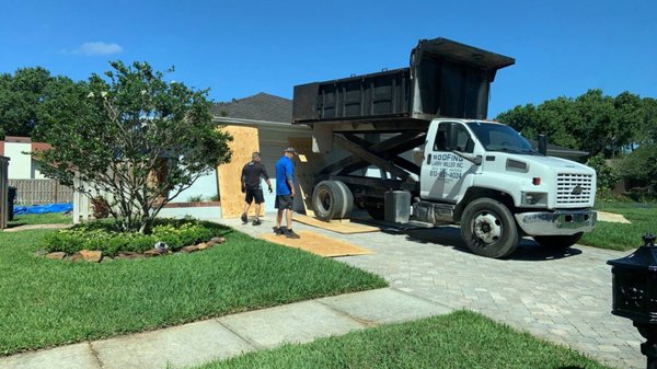 Larry Miller Inc. The roofing process; Here you see Franco our Sales Director with the owner Frank setting up on a job site.