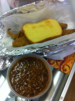 Fried fish on potato bread toast and red beans and rice