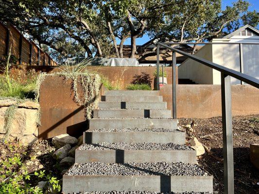 Steel steps with steel retaining walls.